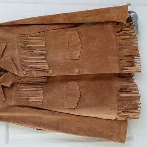 Western style suede jacket.  It's loaded with lots of fringe. It's a small size.